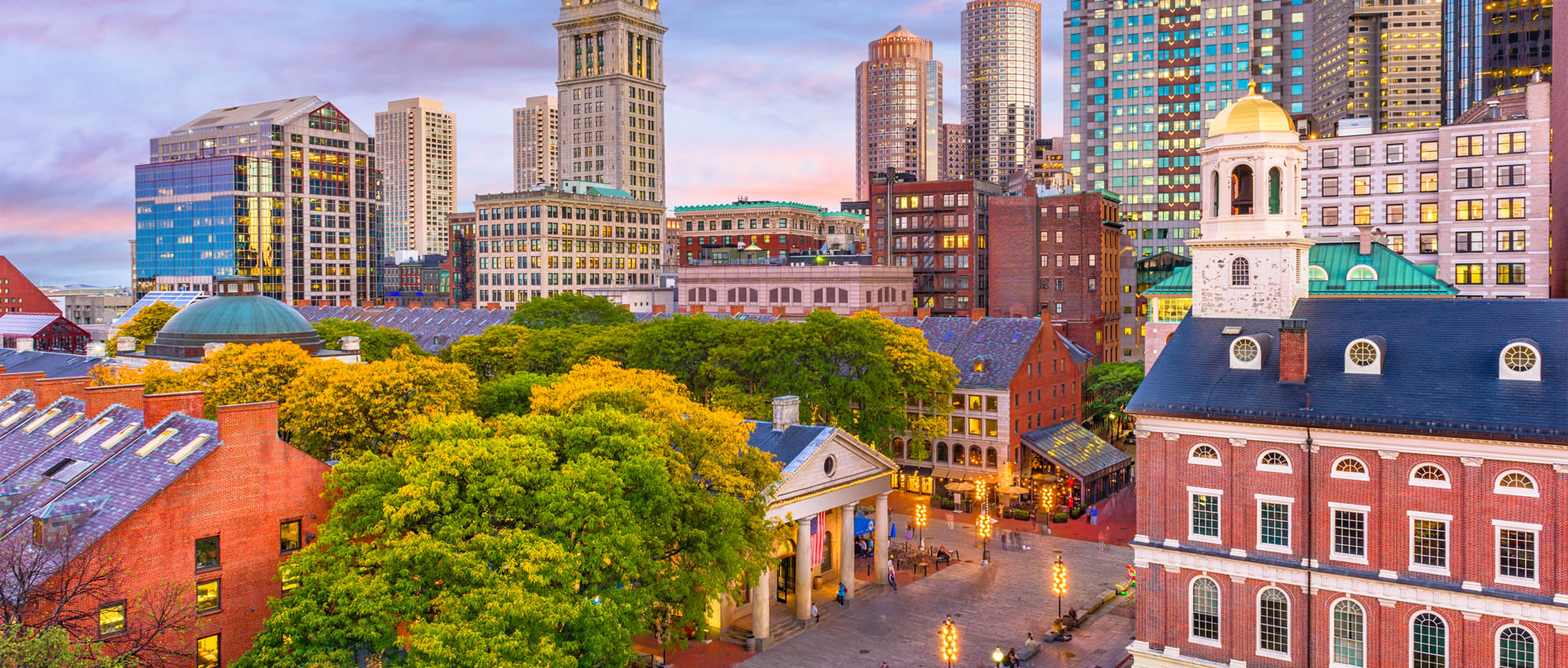 Boston, Massachusetts, USA skyline with Faneuil Hall and Quincy Market at dusk.